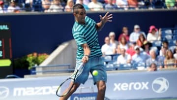Aug 6, 2014; Toronto, Ontario, Canada; Nick Kyrgios plays a forehand against Andy Murray (not pictured) on day three of the Rogers Cup tennis tournament at Rexall Centre. Mandatory Credit: Peter Llewellyn-USA TODAY Sports