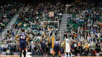 Mar 10, 2014; Salt Lake City, UT, USA; Atlanta Hawks power forward Mike Scott (32) shoots a foul shot while Utah Jazz fans try and distract Scott during the fourth quarter at EnergySolutions Arena. The Atlanta Hawks won the game 112-110. Mandatory Credit: Chris Nicoll-USA TODAY Sports