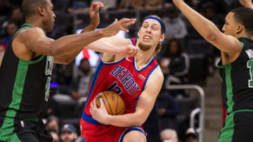 former Miami heat and Detroit Pistons forward Kelly Olynyk (13) drives to the basket against Boston Celtics center Al Horford (42) and forward Grant Williams (12)(Raj Mehta-USA TODAY Sports)