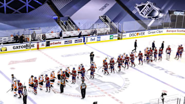TORONTO, ONTARIO - AUGUST 21: The Philadelphia Flyers shake hands with the Montreal Canadiens after defeating them to win Game Six of the Eastern Conference First Round during the 2020 NHL Stanley Cup Playoffs at Scotiabank Arena on August 21, 2020 in Toronto, Ontario. (Photo by Elsa/Getty Images)