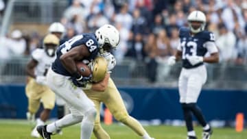 UNIVERSITY PARK, PA - SEPTEMBER 02: Zach Guiser #32 of the Akron Zips tackles Juwan Johnson #84 of the Penn State Nittany Lions immediately after a first down reception during the second half on September 2, 2017 at Beaver Stadium in University Park, Pennsylvania. Penn State defeats Akron 52-0. (Photo by Brett Carlsen/Getty Images)