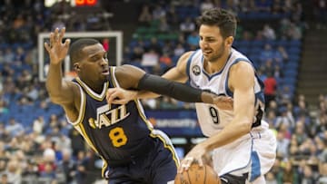 Mar 26, 2016; Minneapolis, MN, USA; Minnesota Timberwolves guard Ricky Rubio (9) drives to the basket through Utah Jazz guard Shelvin Mack (8) in the first half at Target Center. Mandatory Credit: Jesse Johnson-USA TODAY Sports