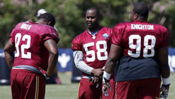 Aug 1, 2015; Richmond, VA, USA; Washington Redskins linebacker Junior Galette (58) talks with nose tackle Chris Baker (92) and defensive tackle Terrance Knighton (98) prior to afternoon practice as part of day three of training camp at Bon Secours Washington Redskins Training Center. Mandatory Credit: Geoff Burke-USA TODAY Sports