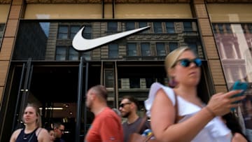NEW YORK, NY - JUNE 15: Shoppers exit Nike SoHo store, June 15, 2017 in New York City. Nike announced plans on Thursday to cut about 2 percent of its global workforce. (Photo by Drew Angerer/Getty Images)