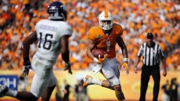 Jan 1, 2016; Tampa, FL, USA; Tennessee Volunteers running back Jalen Hurd (1) runs with the ball as Northwestern Wildcats safety Godwin Igwebuike (16) attempted to defend during the second half in the 2016 Outback Bowl at Raymond James Stadium. Tennessee Volunteers defeated the Northwestern Wildcats 45-6. Mandatory Credit: Kim Klement-USA TODAY Sports