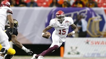 Dec 17, 2016; Atlanta, GA, USA; North Carolina Central Eagles quarterback Malcolm Bell (15) runs the ball Grambling State Tigers in the first quarter at the Georgia Dome. Mandatory Credit: Brett Davis-USA TODAY Sports