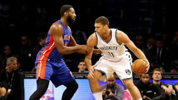 Oct 6, 2016; Brooklyn, NY, USA; Brooklyn Nets center Brooks Lopez (11) plays the ball while being defended by and Detroit Pistons center Andre Drummond (0) during the first half at Barclays Center. Mandatory Credit: Andy Marlin-USA TODAY Sports