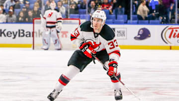 BUFFALO, NY - NOVEMBER 11: New Jersey Devils Defenseman Yohann Auvitu (33) looks to pass during the New Jersey Devils and Buffalo Sabres NHL game on November 11, 2016, at KeyBank Center in Buffalo, NY. (Photo by John Crouch/Icon Sportswire via Getty Images.)