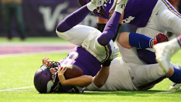 MINNEAPOLIS, MN - SEPTEMBER 23: Kirk Cousins #8 of the Minnesota Vikings is sacked by Jerry Hughes #55 of the Buffalo Bills in the first half of the game at U.S. Bank Stadium on September 23, 2018 in Minneapolis, Minnesota. (Photo by Adam Bettcher/Getty Images)