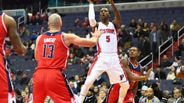 Dec 16, 2016; Washington, DC, USA; Detroit Pistons guard Kentavious Caldwell-Pope (5) shoots as Washington Wizards center Marcin Gortat (13) and guard Bradley Beal (3) look on during the first half at Verizon Center. Mandatory Credit: Brad Mills-USA TODAY Sports