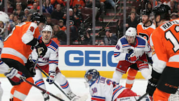 PHILADELPHIA, PA - APRIL 07: Ivan Provorov #9 of the Philadelphia Flyers watches the puck enter the net for a first period goal over a fallen Henrik Lundqvist #30 of the New York Rangers on April 7, 2018 at the Wells Fargo Center in Philadelphia, Pennsylvania. (Photo by Len Redkoles/NHLI via Getty Images)