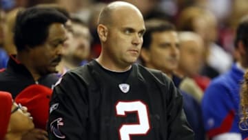 Dec 16, 2012; Atlanta, Georgia, USA; An Atlanta Falcons fan participates in the moment of silence for Sandy Hook Elementary School before the game against the New York Giants at The Georgia Dome. Mandatory Credit: Josh D. Weiss-USA TODAY Sports
