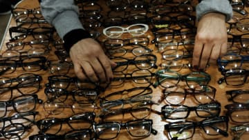 KNOXVILLE, TENNESSEE - FEBRUARY 01: People look at eye glasses at a Remote Area Medical Clinic (RAM) on February 01, 2019 in Knoxville, Tennessee. Friday is the first day of treatment for the three day clinic in what will be the health organization's 1000th clinic. More than a thousand people are expected seeking free dental, medical and vision care at the event. RAM provides free medical care through mobile clinics in underserved, isolated, or impoverished communities around the country and world. As health-care continues to be a contentious issue in America, an estimated 29 million Americans, about one in 10, lack coverage. (Photo by Spencer Platt/Getty Images)