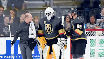 LAS VEGAS, NV - OCTOBER 21: Goalie Malcolm Subban #30 of the Vegas Golden Knights is helped off the ice by a trainer and Nate Schmidt #88 after an injury against the St. Louis Blues at T-Mobile Arena on October 21, 2017 in Las Vegas, Nevada. The Golden Knights won 3-2 in overtime. (Photo by David Becker/NHLI via Getty Images)