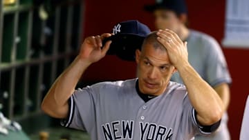 May 18, 2016; Phoenix, AZ, USA; New York Yankees manager Joe Girardi reacts in the dugout against the Arizona Diamondbacks at Chase Field. Mandatory Credit: Mark J. Rebilas-USA TODAY Sports