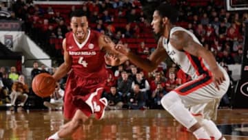 Jan 23, 2016; Athens, GA, USA; Arkansas Razorbacks guard Jabril Durham (4) drives against Georgia Bulldogs guard Charles Mann (4) during the first half at Stegeman Coliseum. Georgia defeated Arkansas 76-73 in overtime. Mandatory Credit: Dale Zanine-USA TODAY Sports