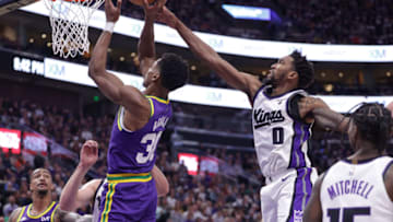 Oct 25, 2023; Salt Lake City, Utah, USA; Sacramento Kings guard Malik Monk (0) tries to block the shot of Utah Jazz guard Ochai Agbaji (30) during the second half at Delta Center. Mandatory Credit: Chris Nicoll-USA TODAY Sports