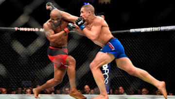 LAS VEGAS, NV - JULY 08: (R-L) Robert Whittaker of New Zealand punches Yoel Romero of Cuba in their interim UFC middleweight championship bout during the UFC 213 event at the T-Mobile Arena on July 8, 2017 in Las Vegas, Nevada. (Photo by Jeff Bottari/Zuffa LLC/Zuffa LLC via Getty Images)
