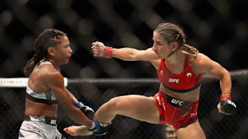 Aug 7, 2021; Houston, Texas, USA; Tecia Torres (red gloves) fights Angela Hill (blue gloves) during UFC 265 at Toyota Center. Mandatory Credit: Troy Taormina-USA TODAY Sports
