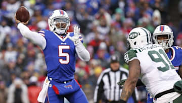 Jan 3, 2016; Orchard Park, NY, USA; Buffalo Bills quarterback Tyrod Taylor (5) throws a pass under pressure by New York Jets defensive end Sheldon Richardson (91) during the second half at Ralph Wilson Stadium. Bills beat the Jets 22-17. Mandatory Credit: Kevin Hoffman-USA TODAY Sports