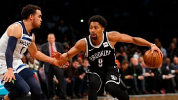 NEW YORK, NY - JANUARY 3: Spencer Dinwiddie #8 of the Brooklyn Nets drives past Tyus Jones #1 of the Minnesota Timberwolves in an NBA basketball game on January 3, 2018 at Barclays Center in the Brooklyn borough of New York City. Nets won 98-97. NOTE TO USER: User expressly acknowledges and agrees that, by downloading and/or using this Photograph, user is consenting to the terms and conditions of the Getty License agreement. Mandatory Copyright Notice (Photo by Paul Bereswill/Getty Images)