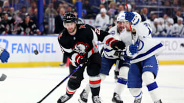 Mar 4, 2023; Buffalo, New York, USA; Buffalo Sabres defenseman Mattias Samuelsson (23) and Tampa Bay Lightning left wing Brandon Hagel (38) go after a loose puck during the second period at KeyBank Center. Mandatory Credit: Timothy T. Ludwig-USA TODAY Sports
