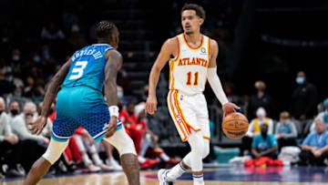 CHARLOTTE, NORTH CAROLINA - JANUARY 23: Terry Rozier #3 of the Charlotte Hornets guards Trae Young #11 of the Atlanta Hawks in the third quarter during their game at Spectrum Center on January 23, 2022 in Charlotte, North Carolina. NOTE TO USER: User expressly acknowledges and agrees that, by downloading and or using this photograph, User is consenting to the terms and conditions of the Getty Images License Agreement. (Photo by Jacob Kupferman/Getty Images)