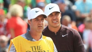 CARNOUSTIE, SCOTLAND - JULY 19: Brooks Koepka of the United States with his caddie Ricky Elliott on the third tee during the first round of the 147th Open Championship at Carnoustie Golf Club on July 19, 2018 in Carnoustie, Scotland. (Photo by Sam Greenwood/Getty Images)