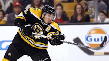 Dec 29, 2015; Boston, MA, USA; Boston Bruins left wing Brad Marchand (63) shoots the puck against the Ottawa Senators during the second period at TD Garden. Mandatory Credit: Winslow Townson-USA TODAY Sports