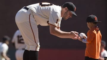 Oct 1, 2016; San Francisco, CA, USA; San Francisco Giants starting pitcher Ty Blach (50) signs an autograph for a fan before the start of the game against the Los Angeles Dodgers at AT&T Park. Mandatory Credit: Neville E. Guard-USA TODAY Sports