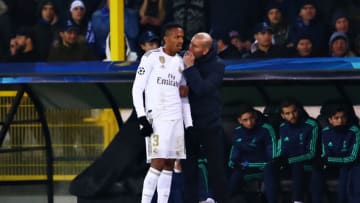 BRUGGE, BELGIUM - DECEMBER 11: Zinedine Zidane, Manager of Real Madrid talks with Eder Militao of Real Madrid during the UEFA Champions League group A match between Club Brugge KV and Real Madrid at Jan Breydel Stadium on December 11, 2019 in Brugge, Belgium. (Photo by Chris Brunskill/Fantasista/Getty Images)