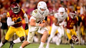 LOS ANGELES, CA - SEPTEMBER 16: Sam Ehlinger #11 of the Texas Longhorns chases the ball after a bad snap during the fourth quarter against the USC Trojans at Los Angeles Memorial Coliseum on September 16, 2017 in Los Angeles, California. (Photo by Harry How/Getty Images)