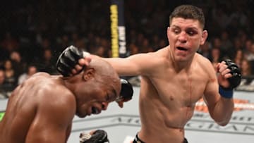 LAS VEGAS, NV - JANUARY 31: (R-L) Nick Diaz punches Anderson Silva of Brazil in their middleweight bout during the UFC 183 event at the MGM Grand Garden Arena on January 31, 2015 in Las Vegas, Nevada. (Photo by Josh Hedges/Zuffa LLC/Zuffa LLC via Getty Images)