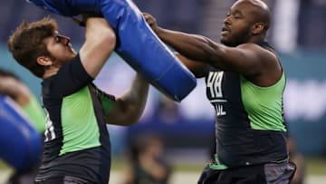Feb 26, 2016; Indianapolis, IN, USA; Ole Miss Rebels offensive lineman Laremy Tunsil (48) squares off in drills against North Carolina State Wolfpack offensive lineman Joe Thuney (44) during the 2016 NFL Scouting Combine at Lucas Oil Stadium. Mandatory Credit: Brian Spurlock-USA TODAY Sports