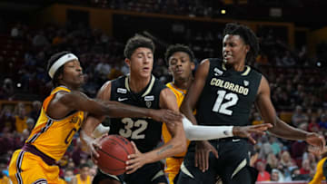 Jan 15, 2022; Tempe, Arizona, USA; Arizona State Sun Devils guard DJ Horne (0) defends against Colorado Buffaloes guard Nique Clifford (32) during the first half at Desert Financial Arena. Mandatory Credit: Joe Camporeale-USA TODAY Sports