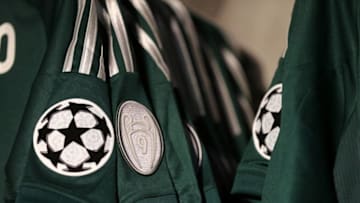 UEFA Champions League logo and a badge commemorating the nine trophies won on an away shirt on sale in the club shop at the Santiago Bernabeu the home stadium of Real Madrid (Photo by AMA/Corbis via Getty Images)