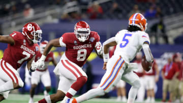 Dec 30, 2020; Arlington, TX, USA; Oklahoma Sooners defensive lineman Perrion Winfrey (8) rushes Florida Gators quarterback Emory Jones (5) in the fourth quarter at ATT Stadium. Mandatory Credit: Tim Heitman-USA TODAY Sports