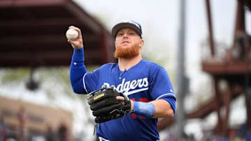 GLENDALE, ARIZONA - MARCH 11: Justin Turner #10 of the Los Angeles Dodgers throws a ball into the stands during a spring training game against the San Francisco Giants at Camelback Ranch on March 11, 2019 in Glendale, Arizona. (Photo by Norm Hall/Getty Images)