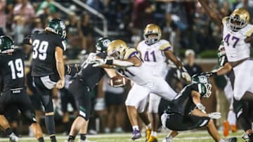 Male's DeAndre Malone blocks the punt of Trinity's Carter Schwartz late in the fourth quarter. The Bulldogs were able to score a field goal to win 23-21 in the waning seconds of the second half in Friday night football. Sept. 16, 2022Trinity Plays Male September 16 2022 Football