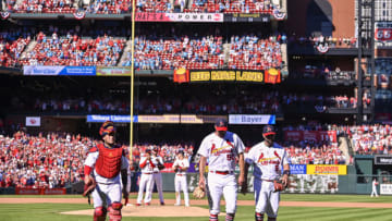 Oct 2, 2022; St. Louis, Missouri, USA; St. Louis Cardinals catcher Yadier Molina (4) starting pitcher Adam Wainwright (50) and first baseman Albert Pujols (5) walk off the field together after all three were removed from the game during the fifth inning against the Pittsburgh Pirates at Busch Stadium. Mandatory Credit: Jeff Curry-USA TODAY Sports