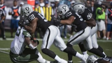 November 1, 2015; Oakland, CA, USA; Oakland Raiders defensive end Khalil Mack (52) tackles New York Jets running back Chris Ivory (33) during the first quarter at O.co Coliseum. Mandatory Credit: Kyle Terada-USA TODAY Sports