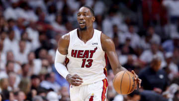 Bam Adebayo #13 of the Miami Heat dribbles against the Boston Celtics(Photo by Michael Reaves/Getty Images)