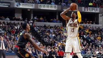 Jan 28, 2016; Indianapolis, IN, USA; Indiana Pacers forward Paul George (13) takes a shot against Atlanta Hawks guard Jeff Teague (0) at Bankers Life Fieldhouse. Indiana defeats Atlanta 111-92. Mandatory Credit: Brian Spurlock-USA TODAY Sports