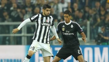 TURIN, ITALY - MAY 05: Alvaro Morata of Juventus FC competes for the ball with Raphael Varane of Real Madrid CF during the UEFA Champions League semi final match between Juventus and Real Madrid CF at Juventus Arena on May 5, 2015 in Turin, Italy. (Photo by Marco Luzzani/Getty Images)
