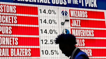 People walk past the 2023 NBA Draft Lottery board Credit: David Banks-USA TODAY Sports