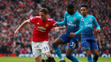 MANCHESTER, ENGLAND - APRIL 29: Nemanja Matic of Manchester United is challenged by Ainsley Maitland-Niles of Arsenal during the Premier League match between Manchester United and Arsenal at Old Trafford on April 29, 2018 in Manchester, England. (Photo by Clive Brunskill/Getty Images)