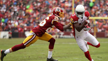 LANDOVER, MD - DECEMBER 17: Wide Receiver Jaron Brown #13 of the Arizona Cardinals is pushed out of bounds by cornerback Bashaud Breeland #26 of the Washington Redskins at FedEx Field on December 17, 2017 in Landover, Maryland. (Photo by Patrick Smith/Getty Images)