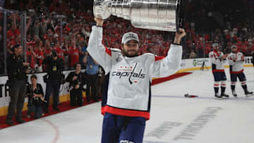 LAS VEGAS, NV - JUNE 07: Nathan Walker #79 of the Washington Capitals hoists the Stanley Cup after Game Five of the 2018 NHL Stanley Cup Final between the Washington Capitals and the Vegas Golden Knights at T-Mobile Arena on June 7, 2018 in Las Vegas, Nevada. The Capitals defeated the Golden Knights 4-3 to win the Stanley Cup Final Series 4-1. (Photo by Dave Sandford/NHLI via Getty Images)