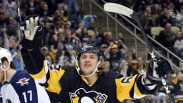 Feb 27, 2016; Pittsburgh, PA, USA; Pittsburgh Penguins left wing Carl Hagelin (62) celebrates his goal against the Winnipeg Jets during the second period at the CONSOL Energy Center. Mandatory Credit: Charles LeClaire-USA TODAY Sports