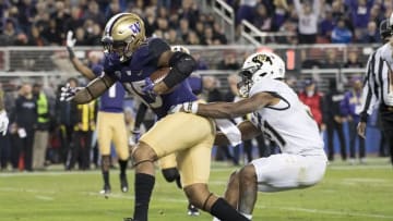 December 2, 2016; Santa Clara, CA, USA; Washington Huskies tight end Darrell Daniels (15) scores a touchdown past Colorado Buffaloes linebacker Kenneth Olugbode (31) during the second quarter in the Pac-12 championship at Levi